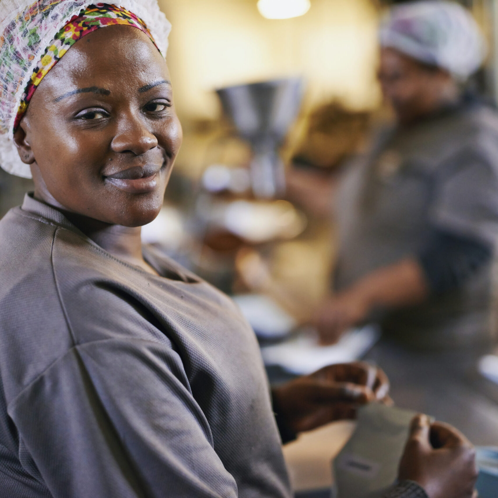 Portrait of a worker in a coffee packaging and distribution warehouse